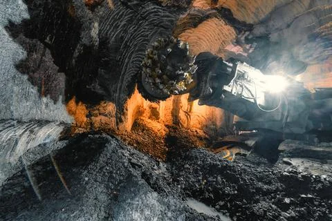 Drilling head of a mine roadheader. Underground mining of ore deposits Stock Photos