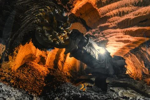 Drilling head of a mine roadheader. Underground mining of ore deposits Stock Photos