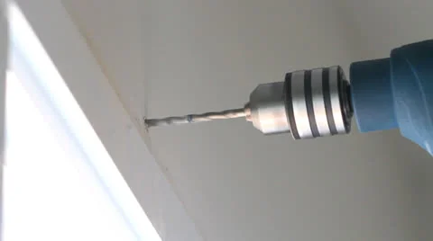 Drilling hole into concrete wall Stock Footage 23918399