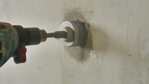 Drilling A hole in Concrete Wall to Install Electric Socket 動画素材 168437374