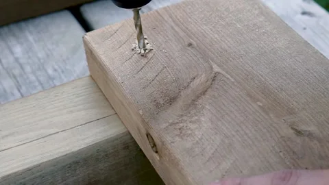 Drilling a Hole in Deck Lumber Stock Footage 133366352