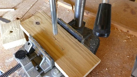 Drilling a hole with a drill press Stock Footage 107334423