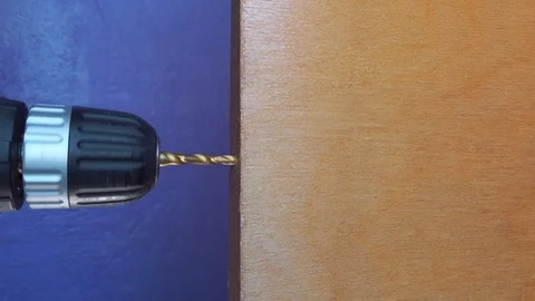 Drilling a hole in the end of the Board Stock Footage 114070879