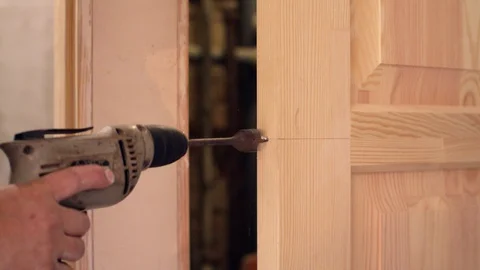 Drilling hole for a lock Video stock 94931665