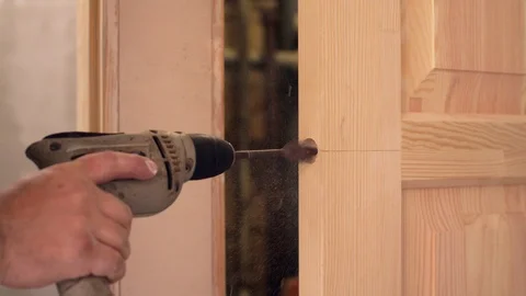 Drilling hole for a lock Video stock 95000516