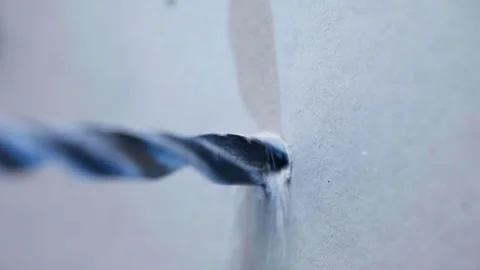 Drilling hole in plasterboard with electric screwdriver, dust from rotating Video stock 302097155