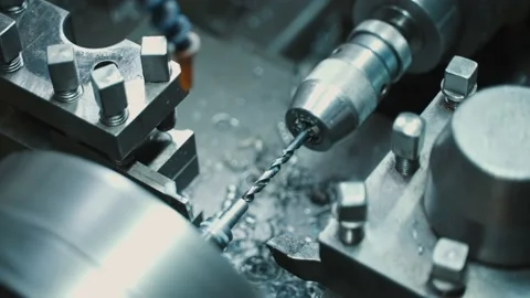 Drilling a hole on a turning machine with a steep drill Stock Footage 225462710