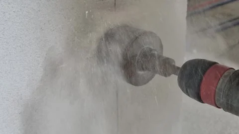 Drilling hole into wall with diamond core drill bit for electrical box Stock Footage 341426790