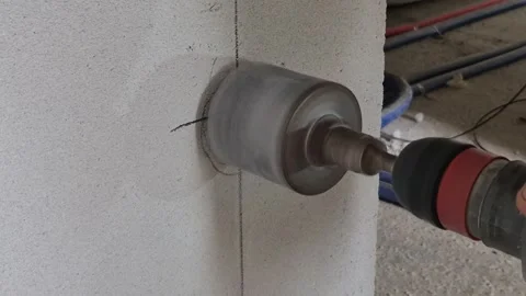 Drilling hole into wall with diamond core drill bit slow motion Stock Footage 341426900