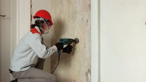 Drilling a hole in the wall for an electrical outlet. 2 Shots. 스톡 동영상 219943553
