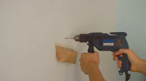 Drilling a Hole in The Wall Stock Footage 67230876