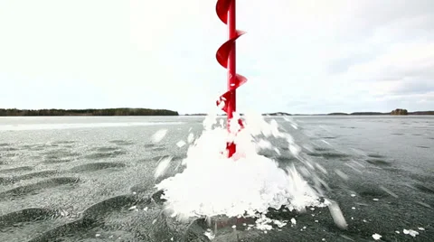 Drilling a hole into weak ice in springtime Stock Footage 36460183