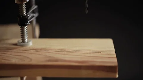 Drilling a hole in wood plank Stock Footage 72197172