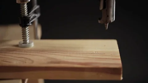 Drilling a hole in wood plank Stock Footage 72197217