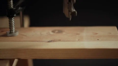 Drilling a hole in wood plank Stock Footage 72197229