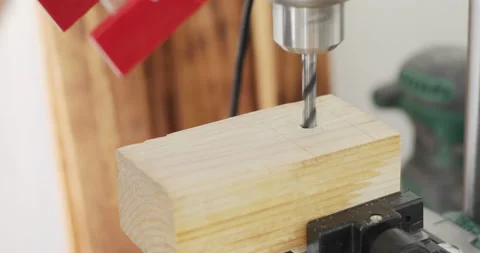 Drilling hole in woodcut using bench pillar drill Stock Footage 155032350