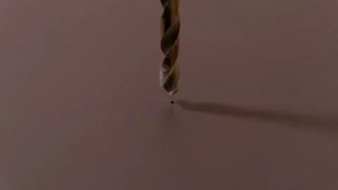 Drilling holes in brown chipboard using an electric drill. The appearance of saw Stock Footage 116647967