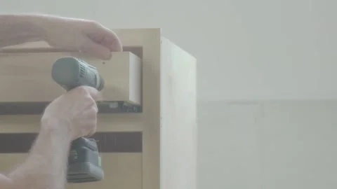Drilling holes in draws Stock Footage 163413823