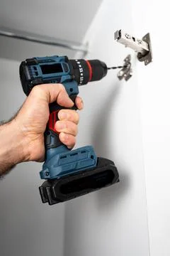 Drilling Holes for Hinge Installation Stock Photos