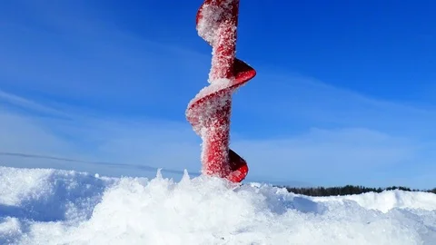 Drilling ice hole with an ice drill Stock Footage 88203477