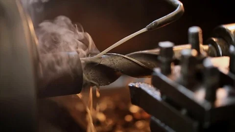 Drilling on lathe with coolant closeup Stock Footage 70208143