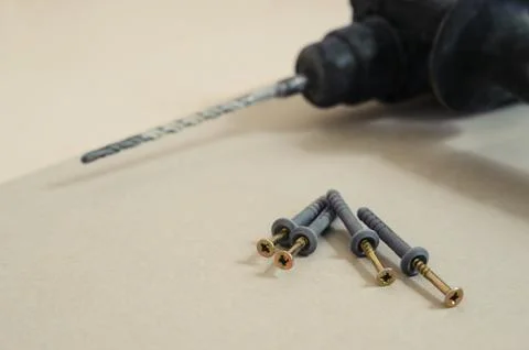 Drilling machine and dowels Stock Photos