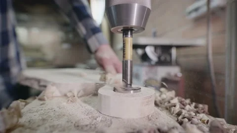 Drilling machine in a carpentry workshop. Hole in a piece of wood. Stock Footage 202118940
