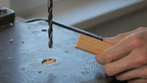Drilling on the machine. Drilling wood. A man works behind a drilling machine. Stock Footage 109302801