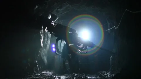 A drilling machine drills into rock Stock Footage 325743206
