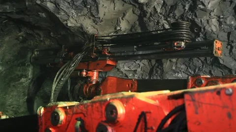 A drilling machine drills into rock Stock Footage 325744118