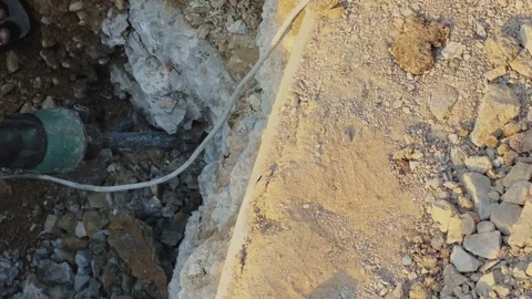 Drilling Machine Excavating Ground at Construction Site Stock Footage 334364365