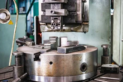 The drilling machine is set up for metalwork, guiding precise drilling operat 스톡 사진