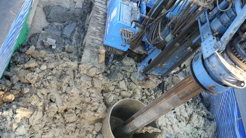Drilling machine working on the road for mass transit transportation project Stock Footage 101464590