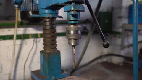 Drilling machine in workshop with tools and equipment during work hours in an Stock Footage 330638212