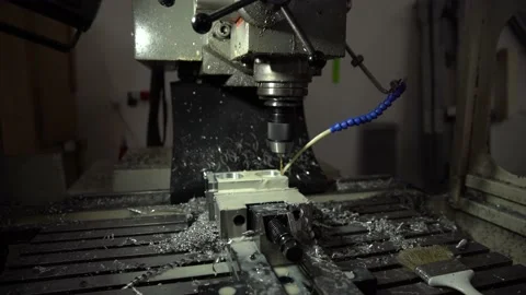 Drilling metal plates with the help of a drill and water. Flat 4K video Stock Footage 148720584