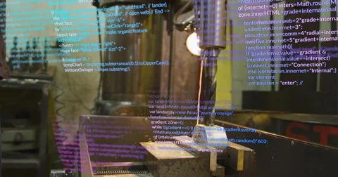 Drilling metal workpiece in vice by drill press at workshop, with overlaid Ja Stock-Fotos
