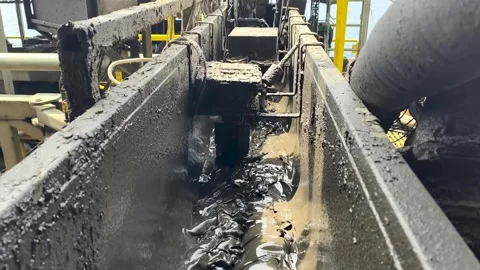 Drilling Mud Return Flow and Flow Sensor Paddle in the Rig Flowline Stock Footage 342293558