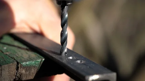 Drilling into an object in slow motion Stock Footage 85510733
