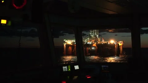 Drilling offshore platform in lights. View from vessel bridge window. Stock Footage 169481499