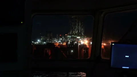 Drilling offshore platform in lights. View from vessel bridge window. RIG Stock Footage 208320148