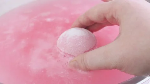 Drilling pink fluid. Foam and bubbles when dissolving a salt cosmetic bomb. Stock Footage 234070722