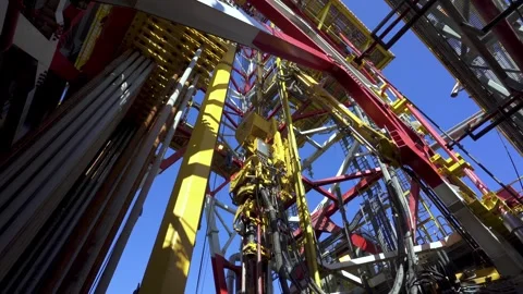 Drilling platform. Derrick. Top drive goes up. Drill pipes in holder Stock Footage 240840890
