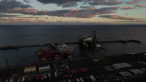 Drilling platform operations at sunset on Tenerife's beautiful coast Stock Footage 295455771