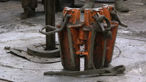 Drilling platform. Pipe rotates. Manual slips. Drilling process. Offshore Stock Footage 172023259