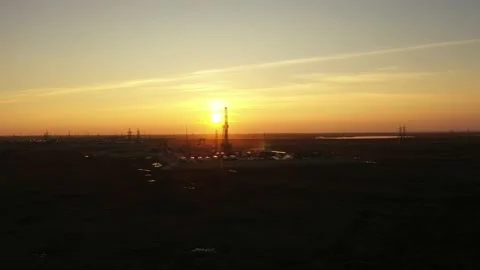 Drilling platform in the sun. Aerial view. White trailers around the drilling Stock Footage 162927387