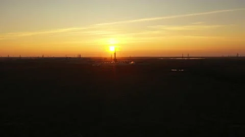 Drilling platform in the sun. Aerial view. White trailers around the drilling Stock Footage 166003427