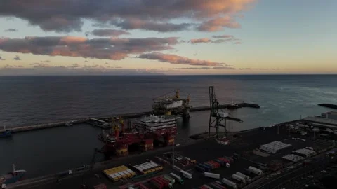Drilling platform at sunset with vibrant skies over Tenerife's coastline Stock Footage 295455769