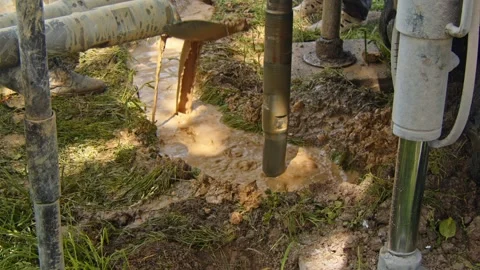 Drilling process to install a water well in rural area for community use Stock Footage 336792790