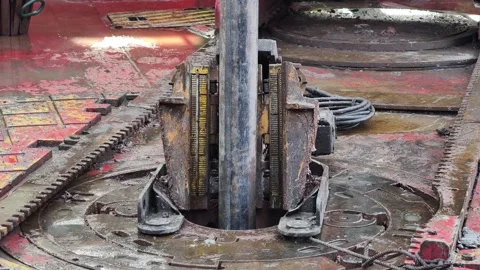 Drilling rig activity - Pull of of hole drill string with oil based mud Stock Footage 346503989