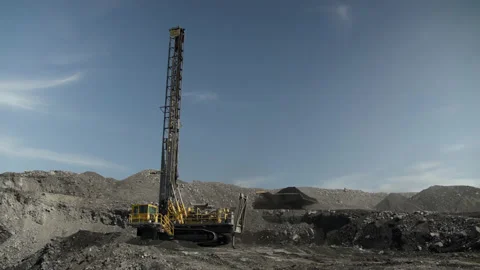 Drilling rig for assessing thickness of coal seam against background of quarry Stock Footage 205244938